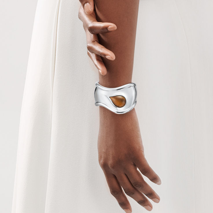 Elsa Peretti®:Small Bone Cuff in Sterling Silver with Tiger's Eye image number 1