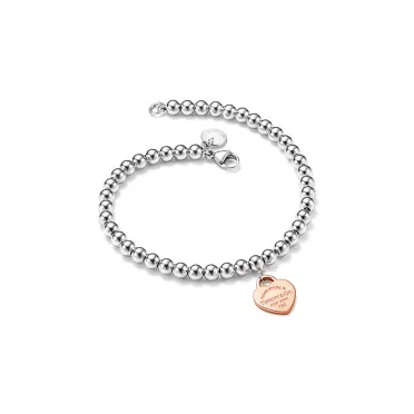 Return to Tiffany™:Pulsera de cuentas con insignia de corazón en plata de ley y oro rosa, 4 mm, 2