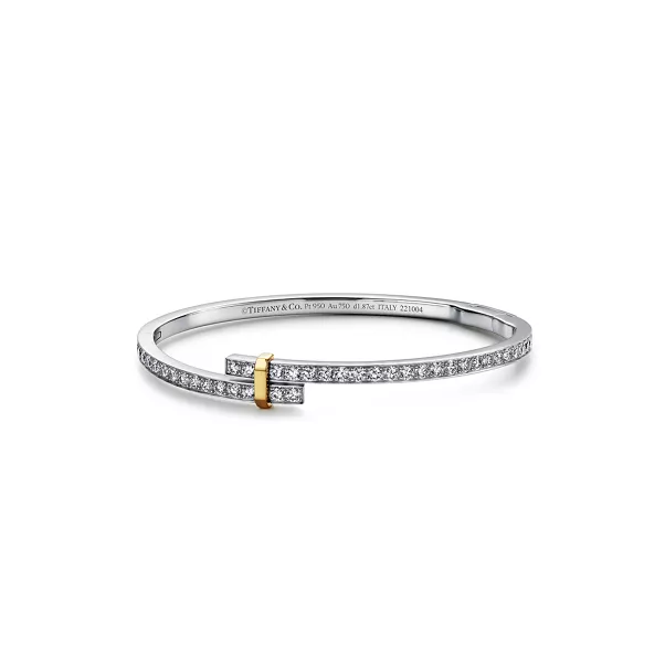 Aufklappbarer, versetzter Armreif in Platin und Gelbgold mit Diamanten