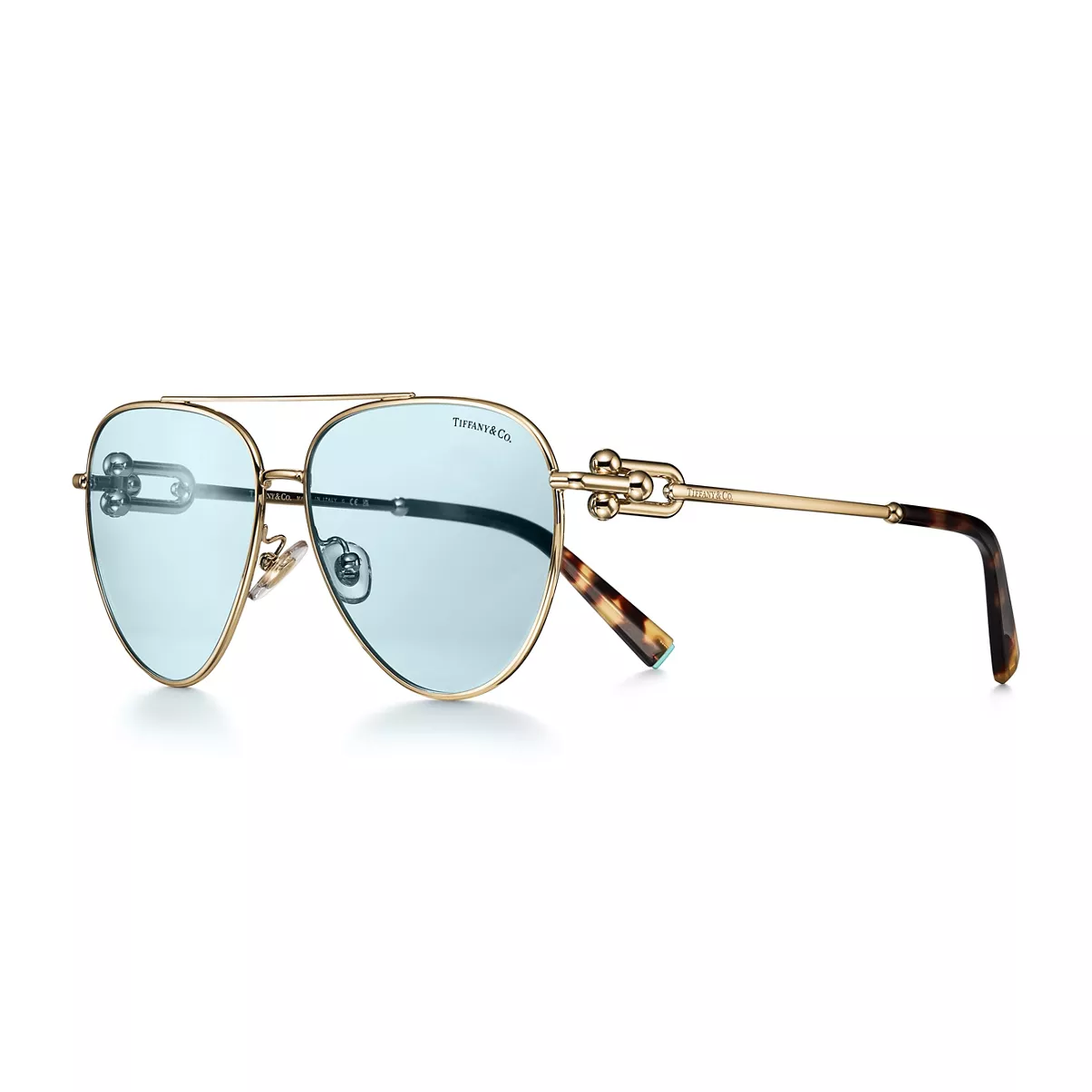 Solaires en m&eacute;tal dor&eacute; p&acirc;le