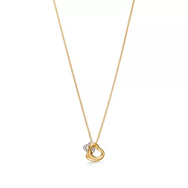Collezione Elsa Peretti®:Pendente Open Heart in oro giallo e platino, 2