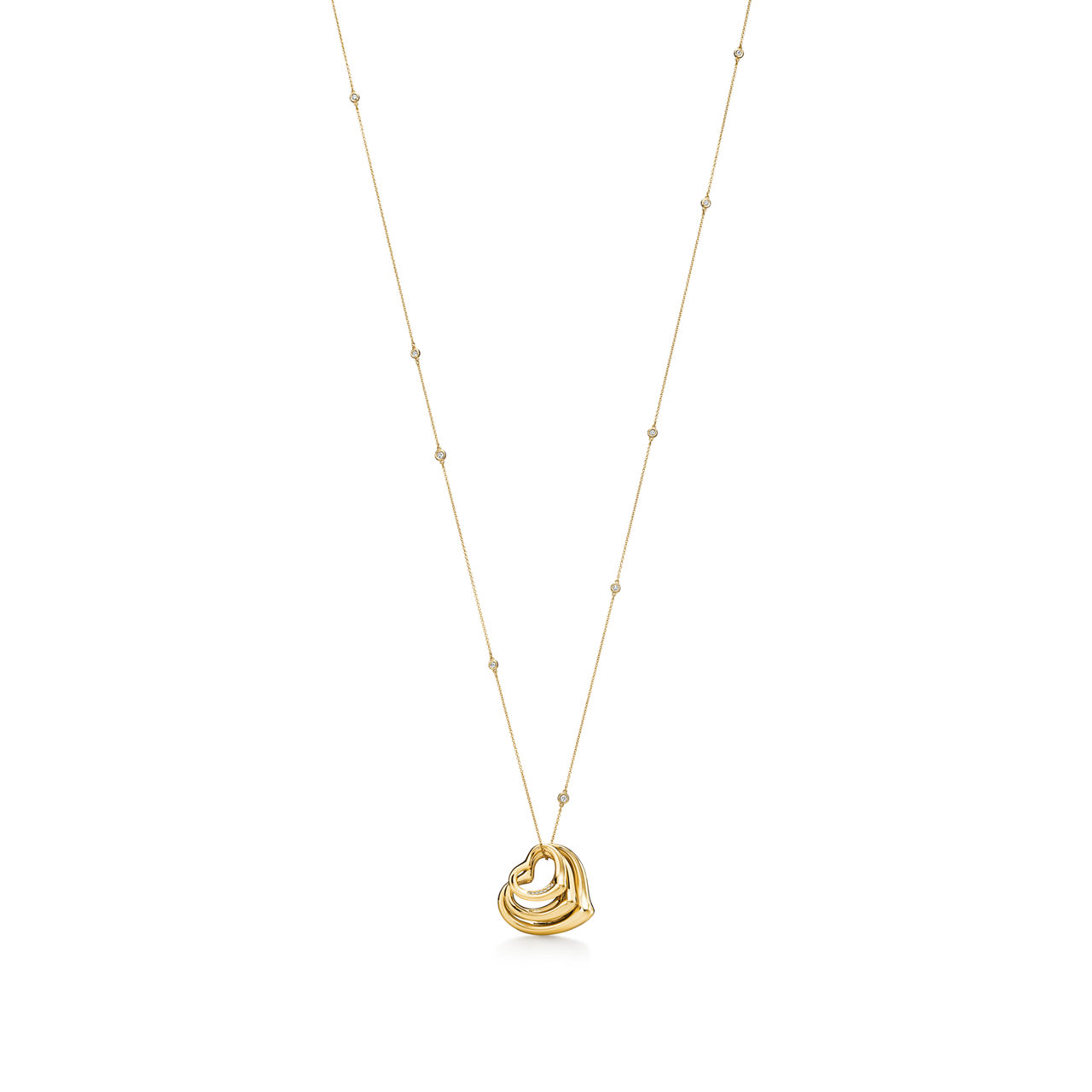 Elsa Peretti®:Open Heart and Diamonds by the Yard® Pendant in Gold with Diamonds image number 0