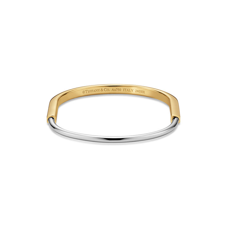 Tiffany Lock:Bracelet jonc étroit en or jaune et or blanc 18 carats numéro dimage {1}