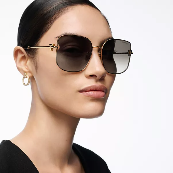 Solaires en métal doré pâle et verres dégradés gris