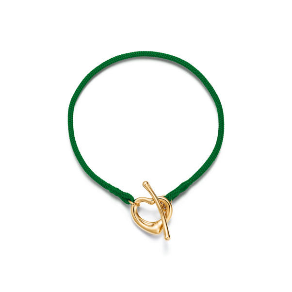 Elsa Peretti®:Open Heart Bracelet in Yellow Gold on a Green Silk Cord