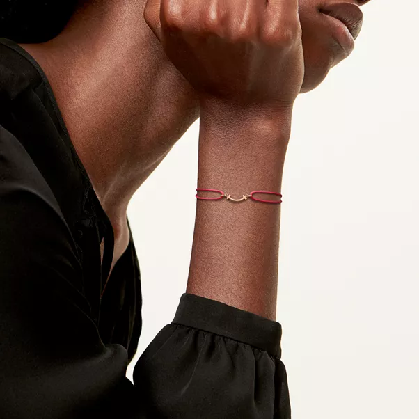 Smile Bracelet in Rose Gold on a Red Cord