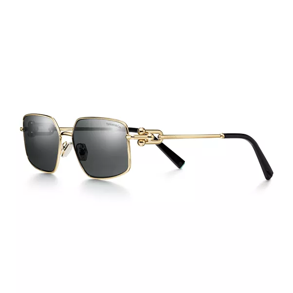 Occhiali da sole in metallo color oro chiaro con lenti grigio scuro