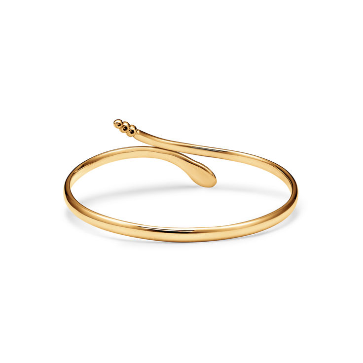 Elsa Peretti®:Snake Bangle in Yellow Gold with Diamonds image number 4