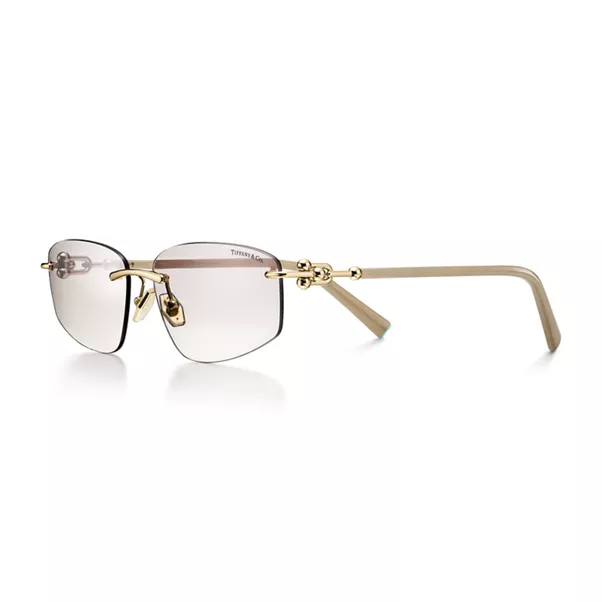 Sunglasses in Pale Gold-colored Metal with Light Gray Lenses