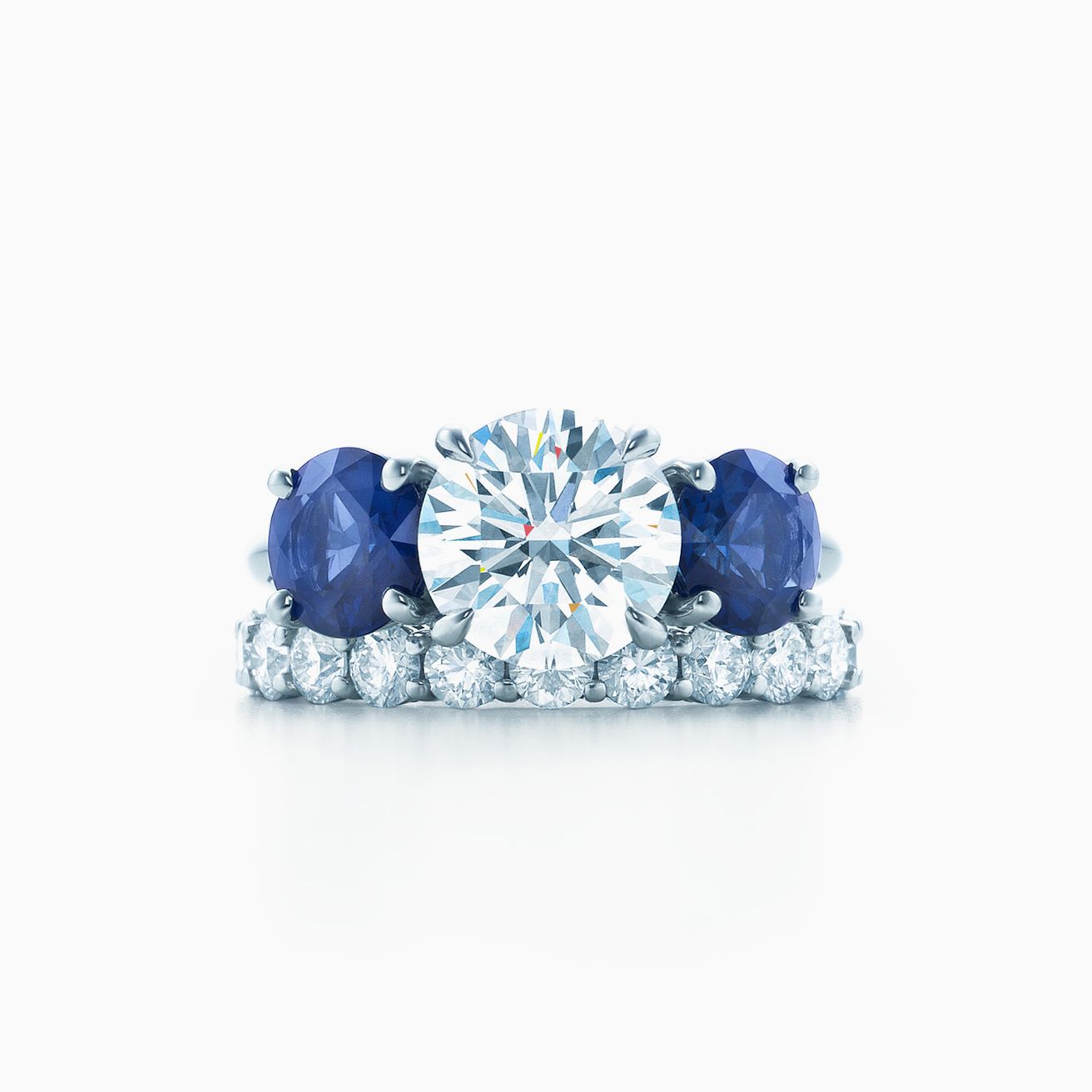 Tiffany Three Stone engagement ring with sapphire side stones in platinum. | Tiffany & Co.